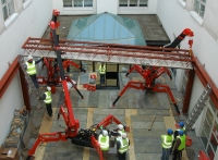 Mini Cranes carrying out tandem lifts in a courtyard in Limerick.